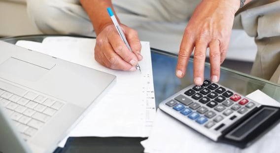 mid-section-of-a-senior-man-calculating-financial-budget-2_squished